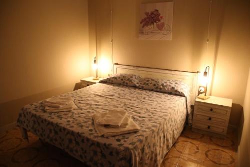 a bedroom with a bed with two towels on it at Il Posticino in Laurino