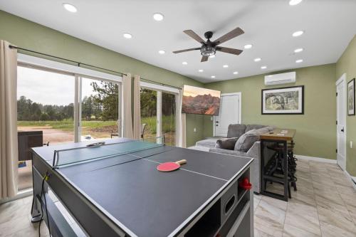 a living room with a ping pong table in it at Custer Gem in Custer