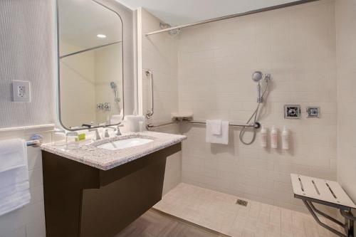 a bathroom with a sink and a shower at Le Meridien Washington, DC, The Madison in Washington