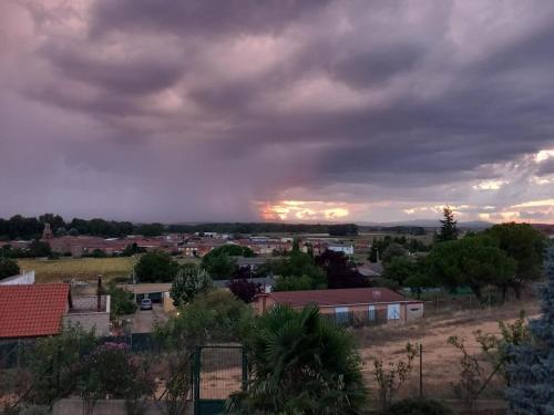 a view of a town with a cloudy sky at Casa Esther and Pepe VUT LE884 in Riego de la Vega