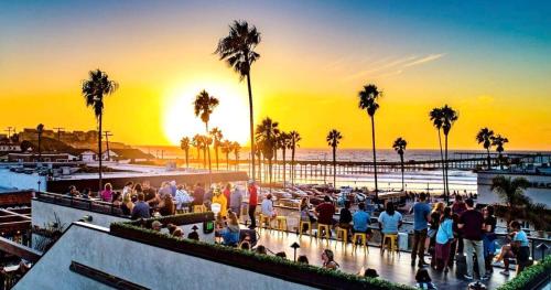 a crowd of people watching the sunset at the beach at Events Allowed: Sunny Villa| Lake| Trails| Beach in La Mesa