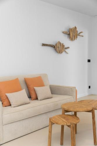 a living room with a couch and a table at Sorobon Bay Hotel in Kralendijk