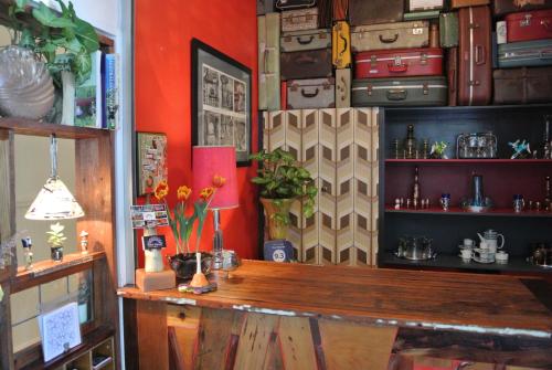 a room with a table and a bunch of suitcases at Vine Valley Inn in Cessnock