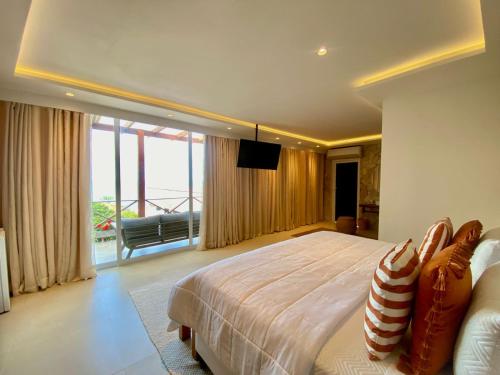 Cama o camas de una habitación en Charme Pousada Boutique & Spa