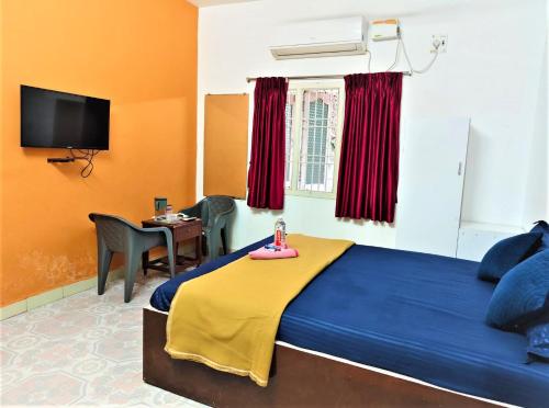 Ένα ή περισσότερα κρεβάτια σε δωμάτιο στο KK Beach View Residency