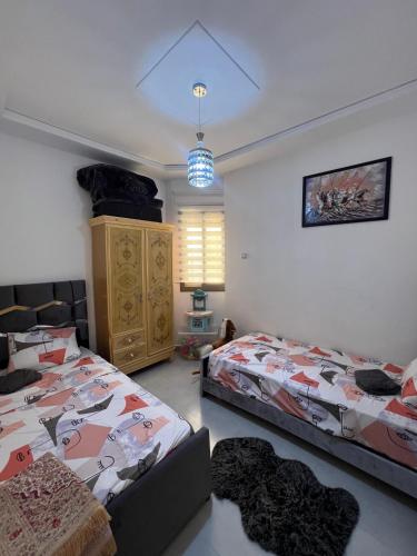 Katil atau katil-katil dalam bilik di Appartement Irena neuf à 5 min de la plage