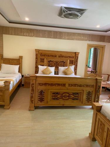 Postel nebo postele na pokoji v ubytování Arcadian Resort Skardu