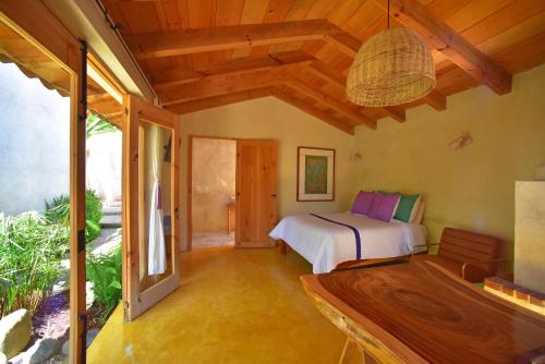 a bedroom with a bed in a room at Las Casas Chiapas in San Cristóbal de Las Casas