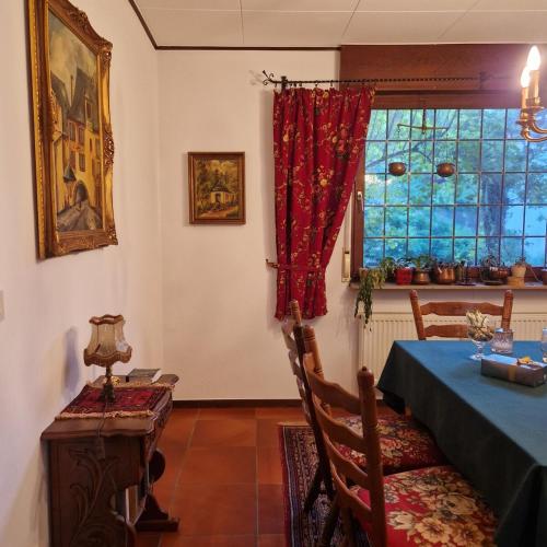 a dining room with a table and a window at Vintage charm with comfort in Bernkastel-Kues