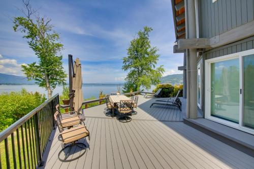a deck with chairs and a view of the water at Stellar Views! Lake Pend Oreille Retreat with Dock in Sagle