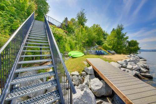 a set of stairs leading down to the water at Stellar Views! Lake Pend Oreille Retreat with Dock in Sagle