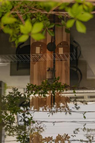 a group of potted plants sitting on a wall at Eisenhut Boutique Hotel in Bolzano