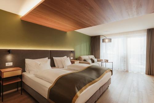 Ένα ή περισσότερα κρεβάτια σε δωμάτιο στο Hotel Diamant