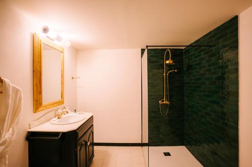 a bathroom with a sink and a shower at Hotel Son Molí Country House in Playa de Palma