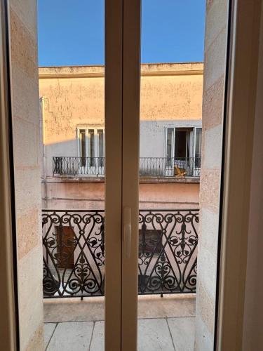 an open door with a view of a balcony at Le Volte Sveve in Mesagne