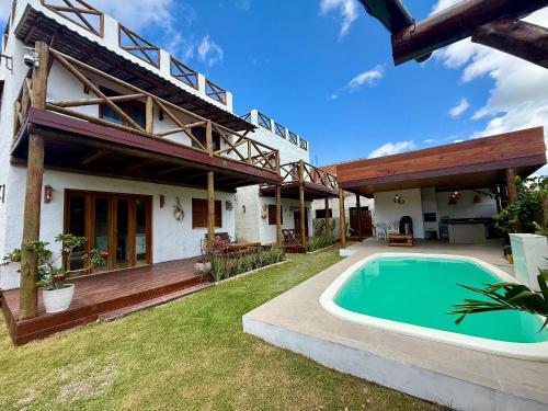 Πισίνα στο ή κοντά στο casa perfeita a 150m da praia com 6 suítes