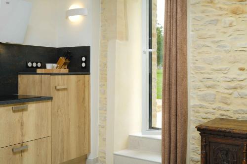 Dapur atau dapur kecil di Appartements La Grande Ferme Crépon - à la campagne 5mn d'Arromanches et 10mn de Bayeux