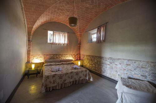 Ένα ή περισσότερα κρεβάτια σε δωμάτιο στο Agriturismo Pieve de Pitti