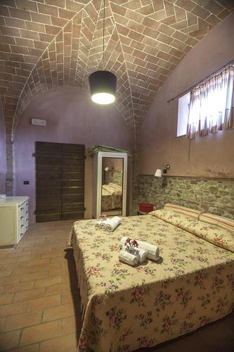 Ένα ή περισσότερα κρεβάτια σε δωμάτιο στο Agriturismo Pieve de Pitti