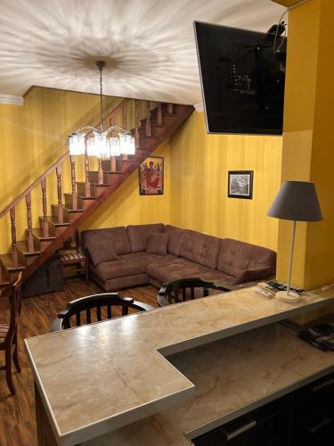 a living room with a couch and a table at Green Villa Sea View in Gonio
