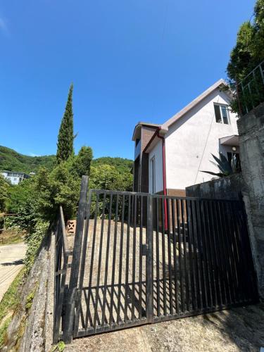 a gate in front of a house at Green Villa Sea View in Gonio