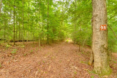 a trail in the woods with a sign on a tree at 6 Mi to Helen Mtn-View Retreat with Hot Tub! in Clarkesville