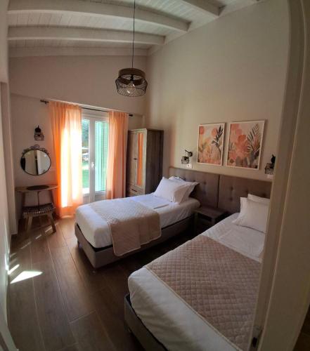 Ένα ή περισσότερα κρεβάτια σε δωμάτιο στο Elysian olive villas