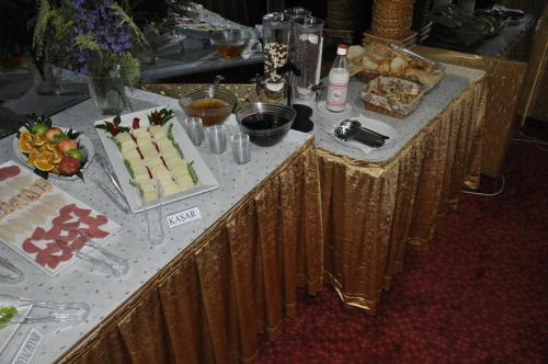a table topped with a table with a cake on it at Kivrak Hotel in Antalya