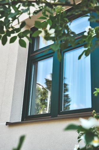 a window on the side of a building at Apartmány Švejdom dom, centrum Bojnice in Bojnice