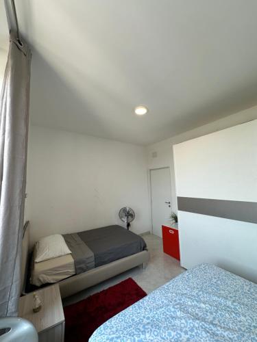 a bedroom with two beds in a room at Siffredi Rooms in Genova