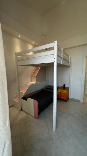 a bedroom with a bunk bed in a room at Siffredi Rooms in Genova