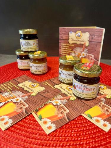 a table topped with jars of food and a box at acasadigiò B&B in Rome