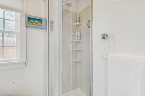 a shower with a glass door in a bathroom at The Jib & The Genoa in Dennis Port