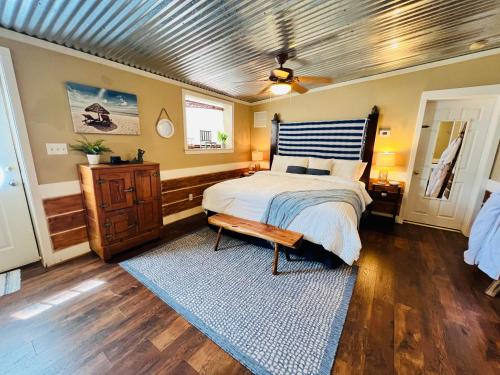 a bedroom with a bed and a wooden ceiling at The Beach Comber in Canton