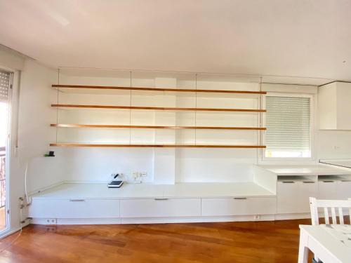 a room with white shelves and a sink at Apartamento Plaza España in Madrid