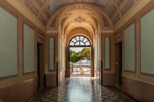 an empty hallway of a building with a ceiling at Palazzo Caputo in Nardò