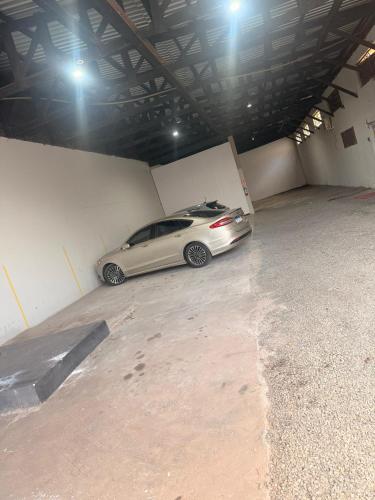 a silver car parked in a parking garage at Itaipu Hotel in Foz do Iguaçu