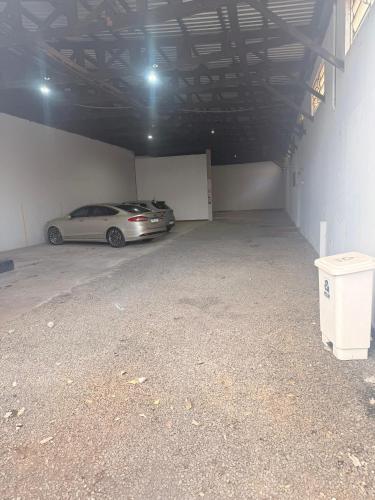 a parking garage with a car parked in it at Itaipu Hotel in Foz do Iguaçu