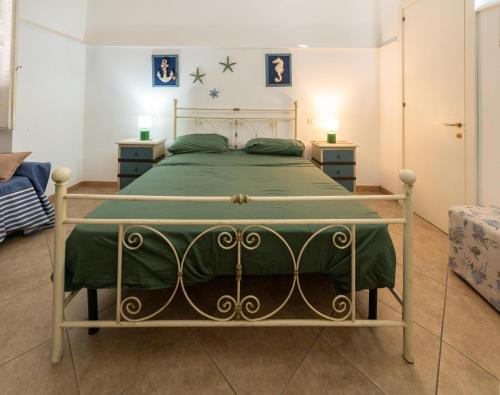 a bedroom with a bed and two night stands at Palazzo Caputo in Nardò