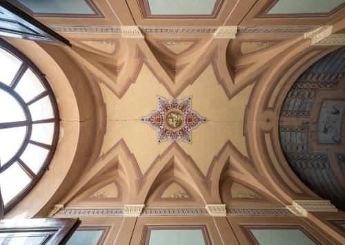 a ceiling in a building with a star on it at Palazzo Caputo in Nardò