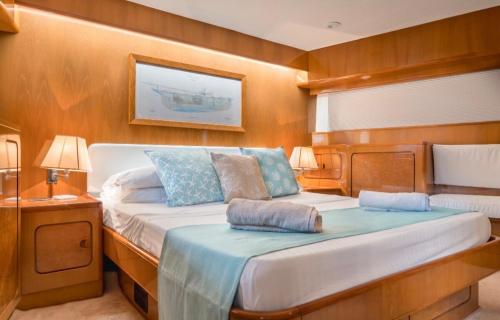 a bedroom with a bed on a boat at La Giorgia Boat in Lacco Ameno