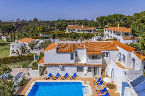 an aerial view of a house with a swimming pool at Villa Canas by Villa Plus in Vale do Lobo