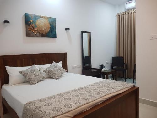 Postel nebo postele na pokoji v ubytování Blackthorn Hotel