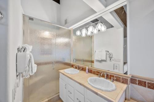 a bathroom with two sinks and a large mirror at Remodeled 4BR Lakefront with Exceptional Amenities in Kings Beach