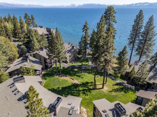 an aerial view of a house with the ocean in the background at Remodeled 4BR Lakefront with Exceptional Amenities in Kings Beach