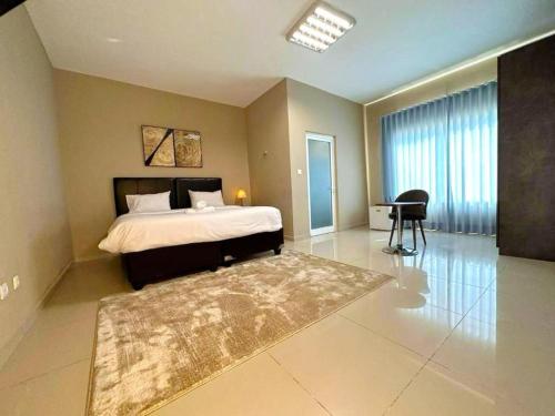 a bedroom with a bed and a desk in it at Decifer Sport Resort in Belas