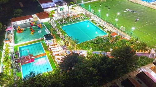 an overhead view of a swimming pool at night at Decifer Sport Resort in Belas