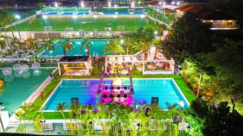 an overhead view of a pool at a resort at night at Decifer Sport Resort in Belas