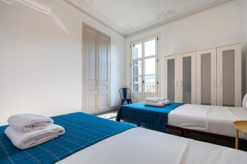 Posteľ alebo postele v izbe v ubytovaní b21-Apartamento Modernista para Grupos