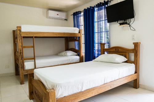 Ένα ή περισσότερα κρεβάτια σε δωμάτιο στο Rocky Cay Lodging
